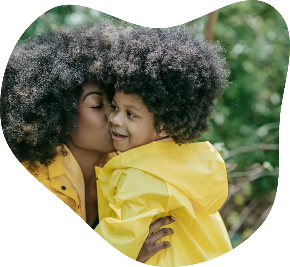 Mother kissing baby girl